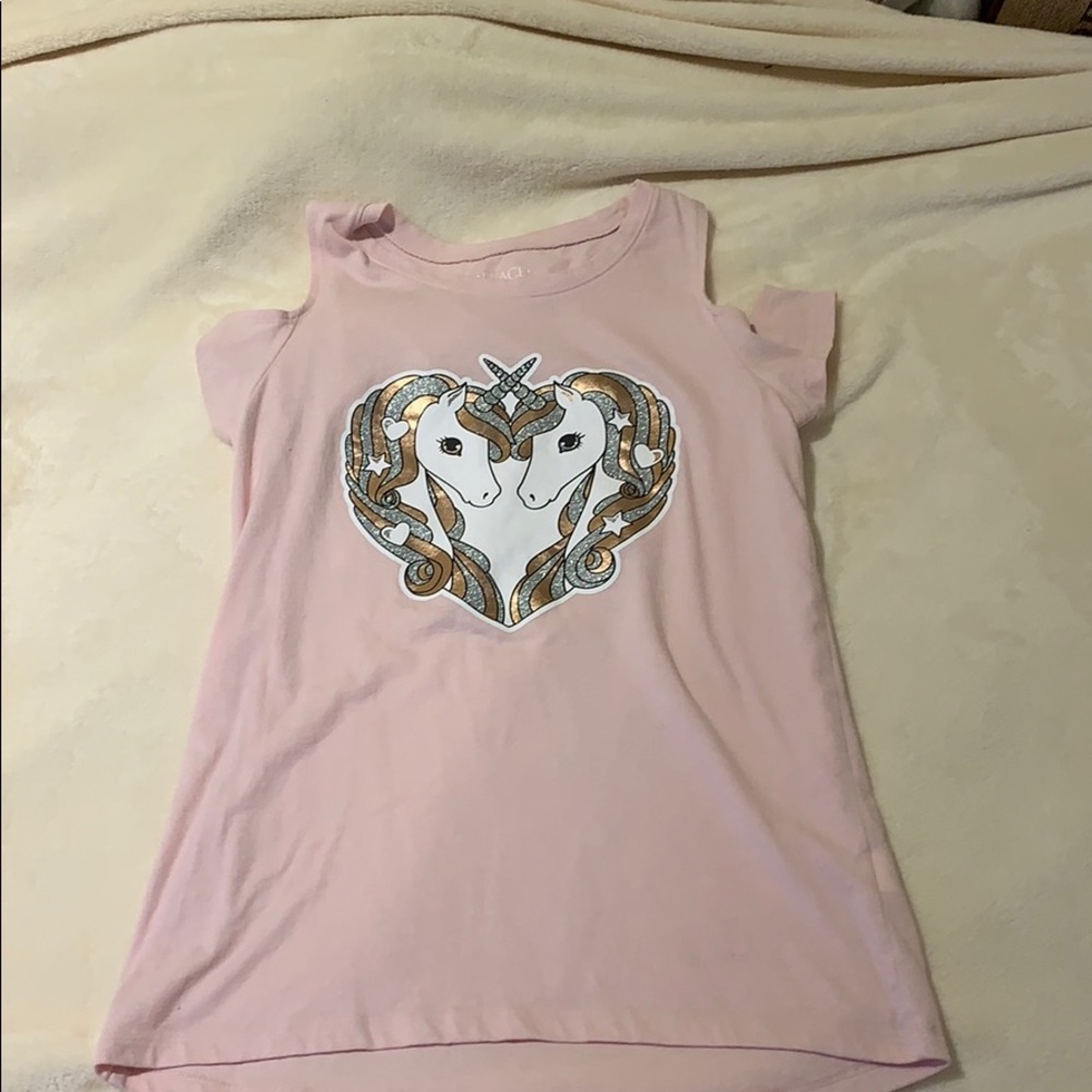 pink top with unicorns